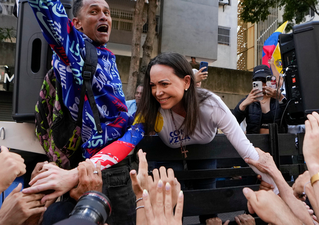 Opposition leader Maria Corina Machado greets supporters during a protest against Venezuelan President Nicolas Maduro the day before his inauguration for a third term in Caracas, Venezuela, Thursday, Jan. 9, 2025. (AP Photo/Matias Delacroix, file)